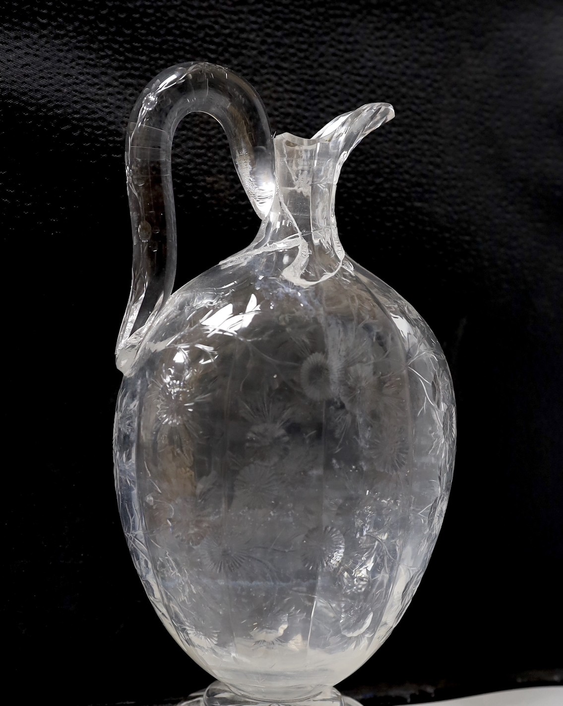 A 19th century Stourbridge ‘’rock crystal’’ claret jug. (cracked). 26.5cm tall